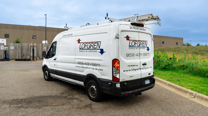 Lofgren Heating & Air Conditioning van arriving at a job